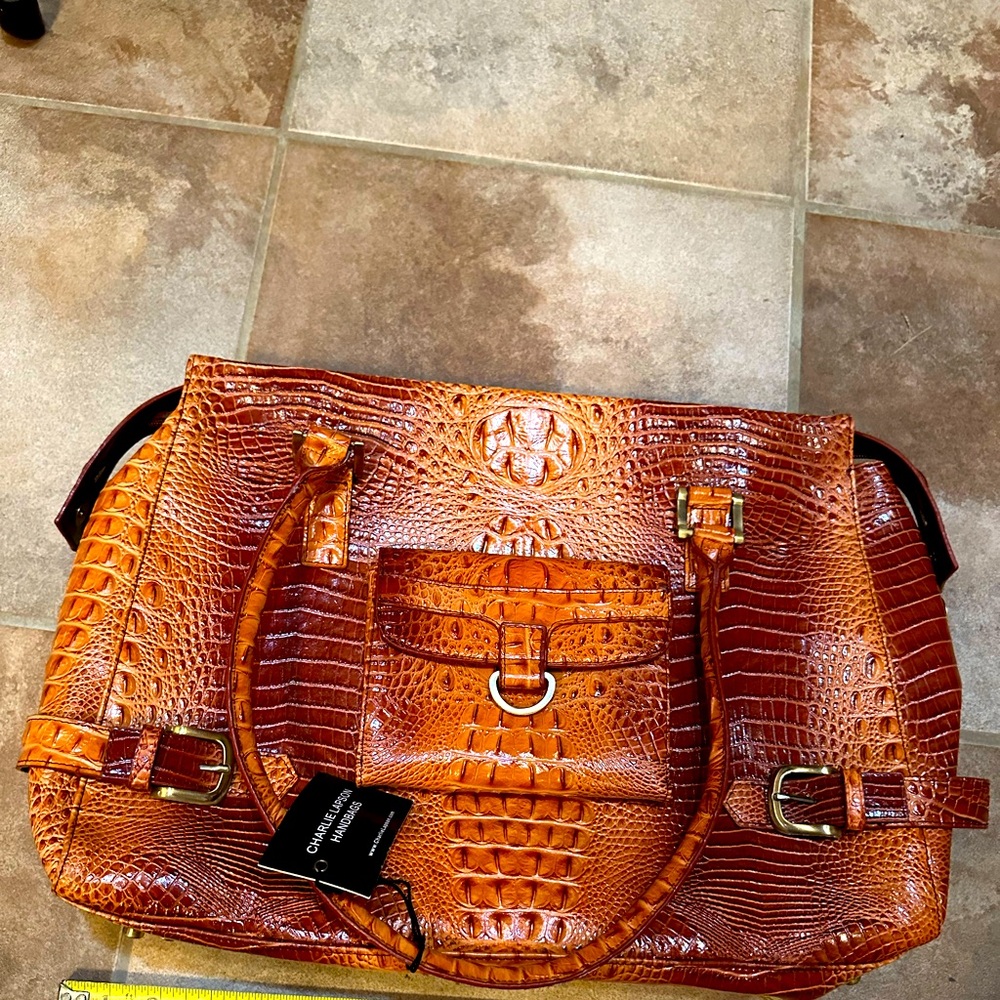 Vintage Charlie Lapson embossed briefcase. Never used. Dust cover included